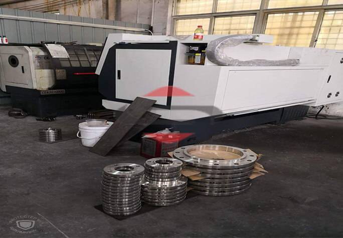 A Machine With A Stack Of Stainless Steel Flanges