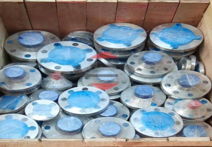 A Box Of Blue And Silver Nickel Flanges